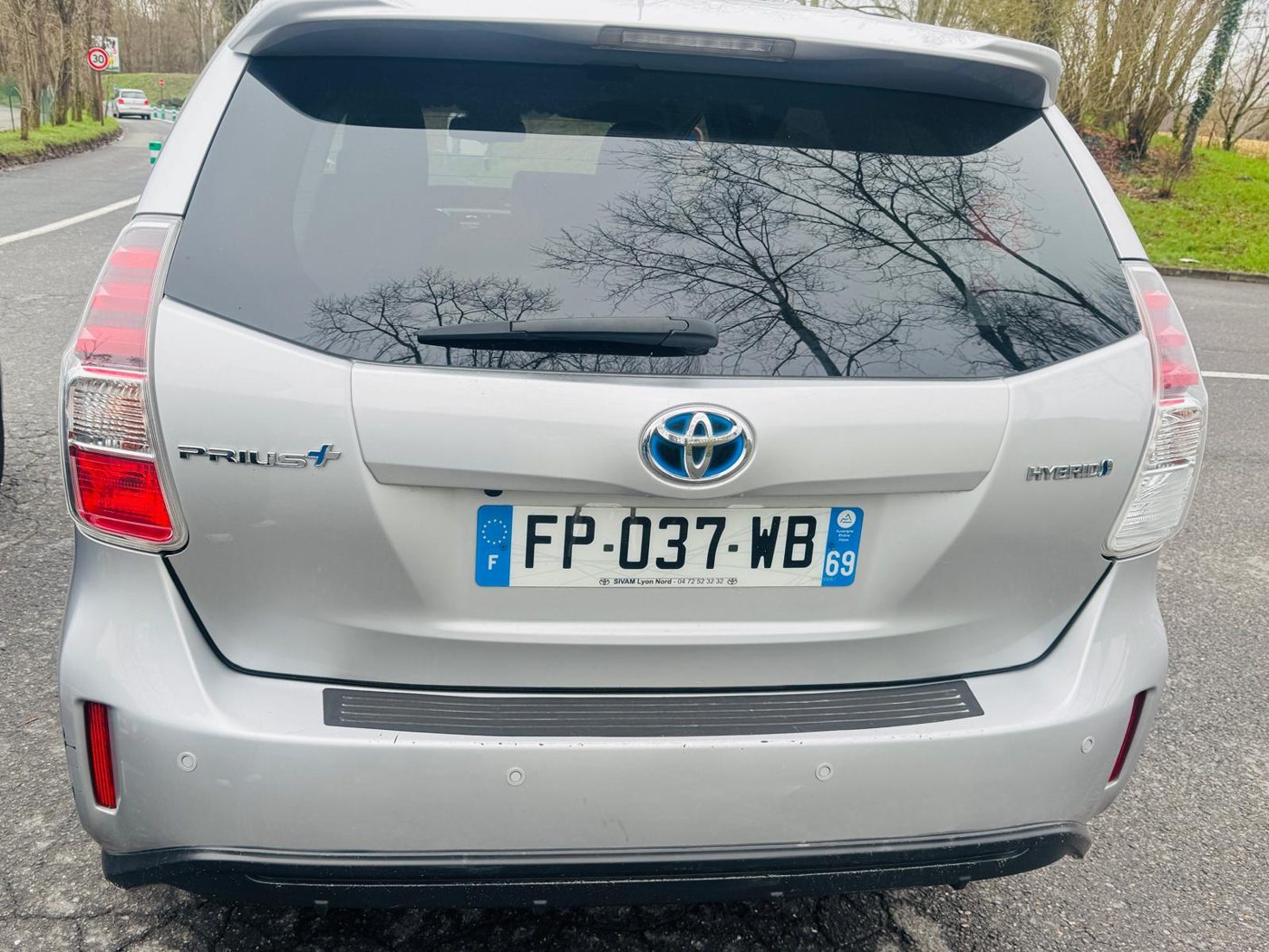 Silver Toyota Prius+ hybrid, rear